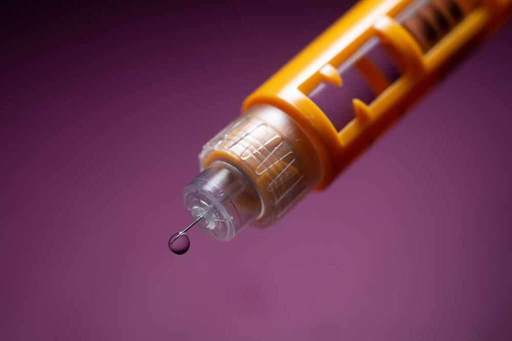 insulin dripping from a needle tip for diabetes