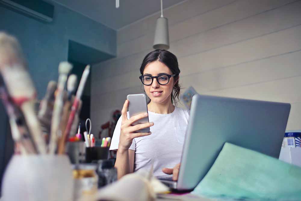 women checking phone for results